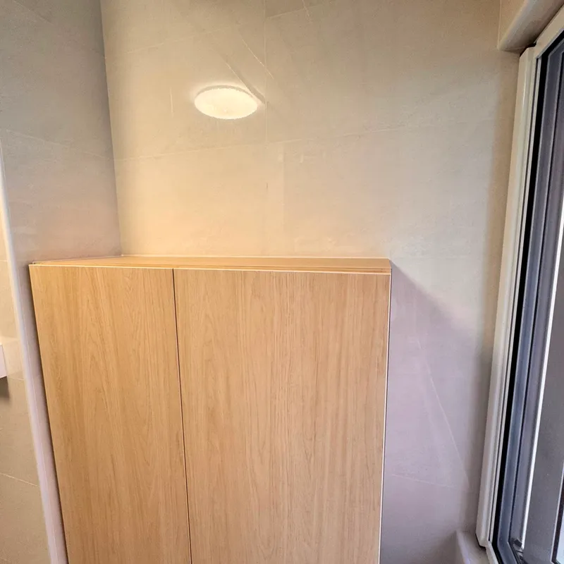 Service yard showing the wall cabinet mounted below the ceiling drying rack